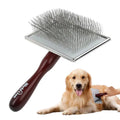 Slicker brush being used on a golden retriever